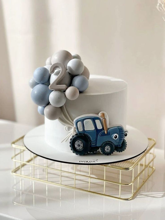 Торт с шариками и с синим трактором